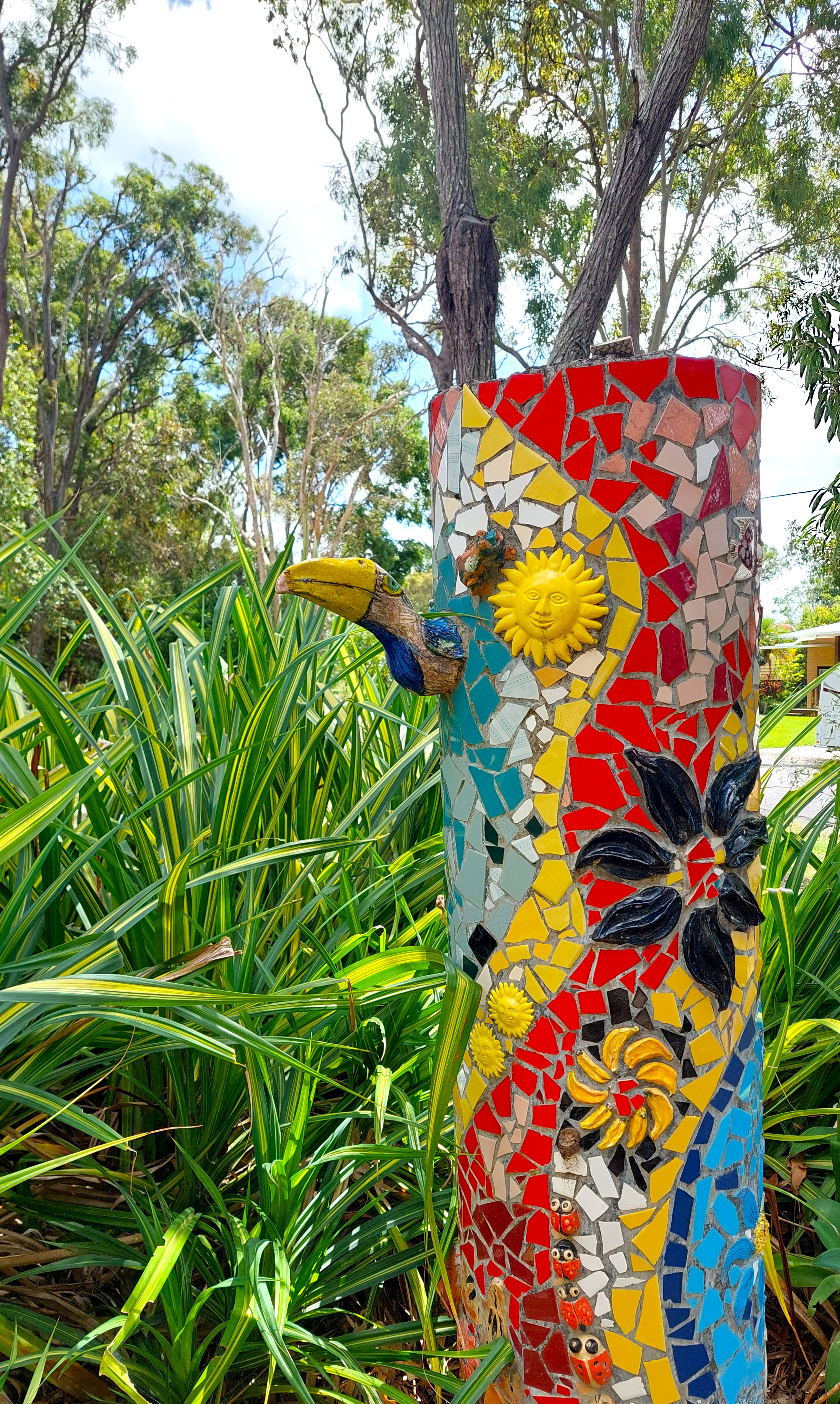Another view of the vibrant mosaic totem pole